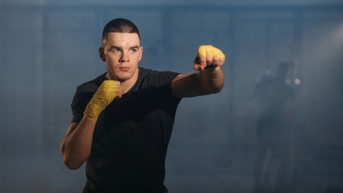 A man training boxing wearing plain black streetwear motivational affirmation shirt by wear grit brand apparel