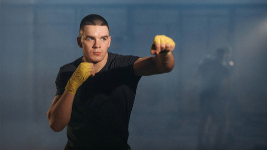 A man training boxing wearing plain black streetwear motivational affirmation shirt by wear grit brand apparel