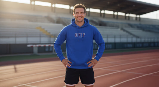 Athlete training in Wear Grit motivational apparel, a blue hoodie with a print "Grit" on it, an affirmation of focusing on growth and discipline