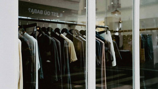 Wear Grit Matters a window of a shopping store with a fashionable clothing hanged displayed