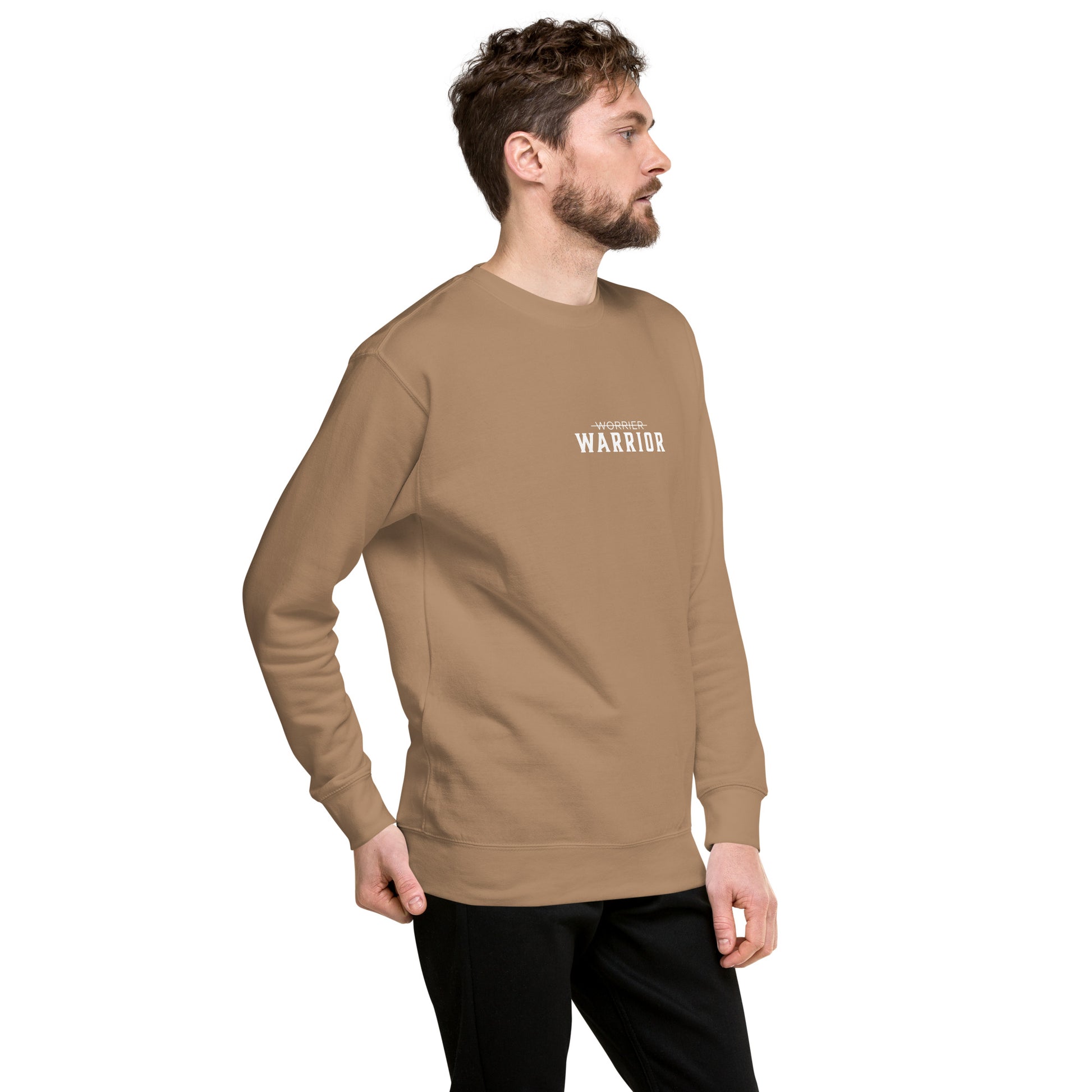 Man wearing a cream long-sleeve shirt with 'WARRIOR' printed on it, a high-quality motivational and mindset-driven sweatshirt apparel by wear grit brand clothing