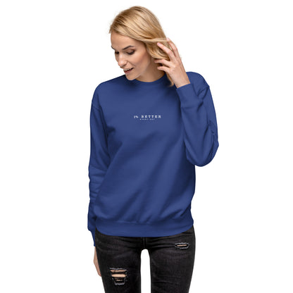 a female model wearing 1% Better Every Day — Motivational Grit Sweatshirt; mindset apparel for leaders and achievers focused on growth and discipline by wear grit brand clothing