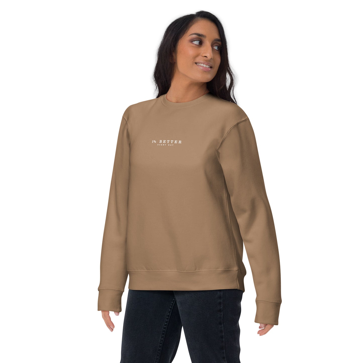 a female model wearing 1% Better Every Day — Motivational Grit biege Sweatshirt; mindset apparel for leaders and achievers focused on growth and discipline by wear grit brand clothing