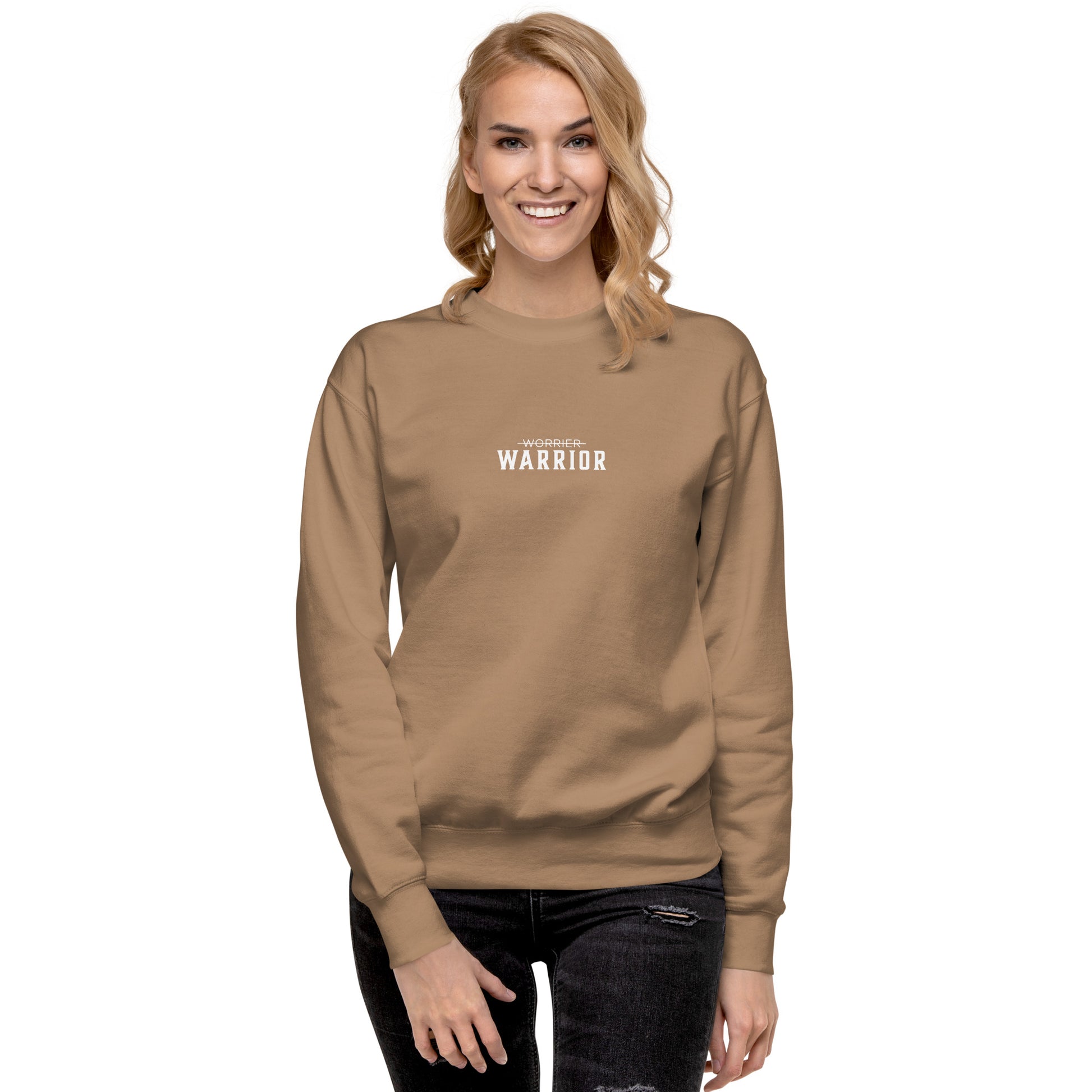 a lady wearing a cream long-sleeve shirt with 'WARRIOR' printed on it, a high-quality motivational and mindset-driven sweatshirt apparel by wear grit brand clothing