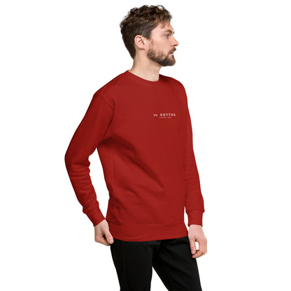 a model with a red sweater with a print 1% Better Every Day — Motivational Grit Sweatshirt; mindset apparel for leaders and achievers focused on growth and discipline by wear grit brand clothing