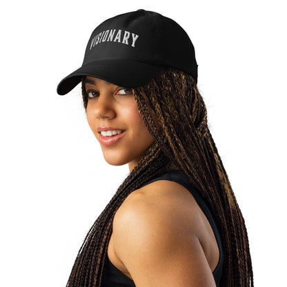 A gorgeous woman wearing black Visionary Under Armour® dad hat with embroidered logo, low-profile unstructured design, curved visor, and adjustable strap for focused, clear, and long-term disciplined everyday grind, product by Wear Grit Brand Clothing