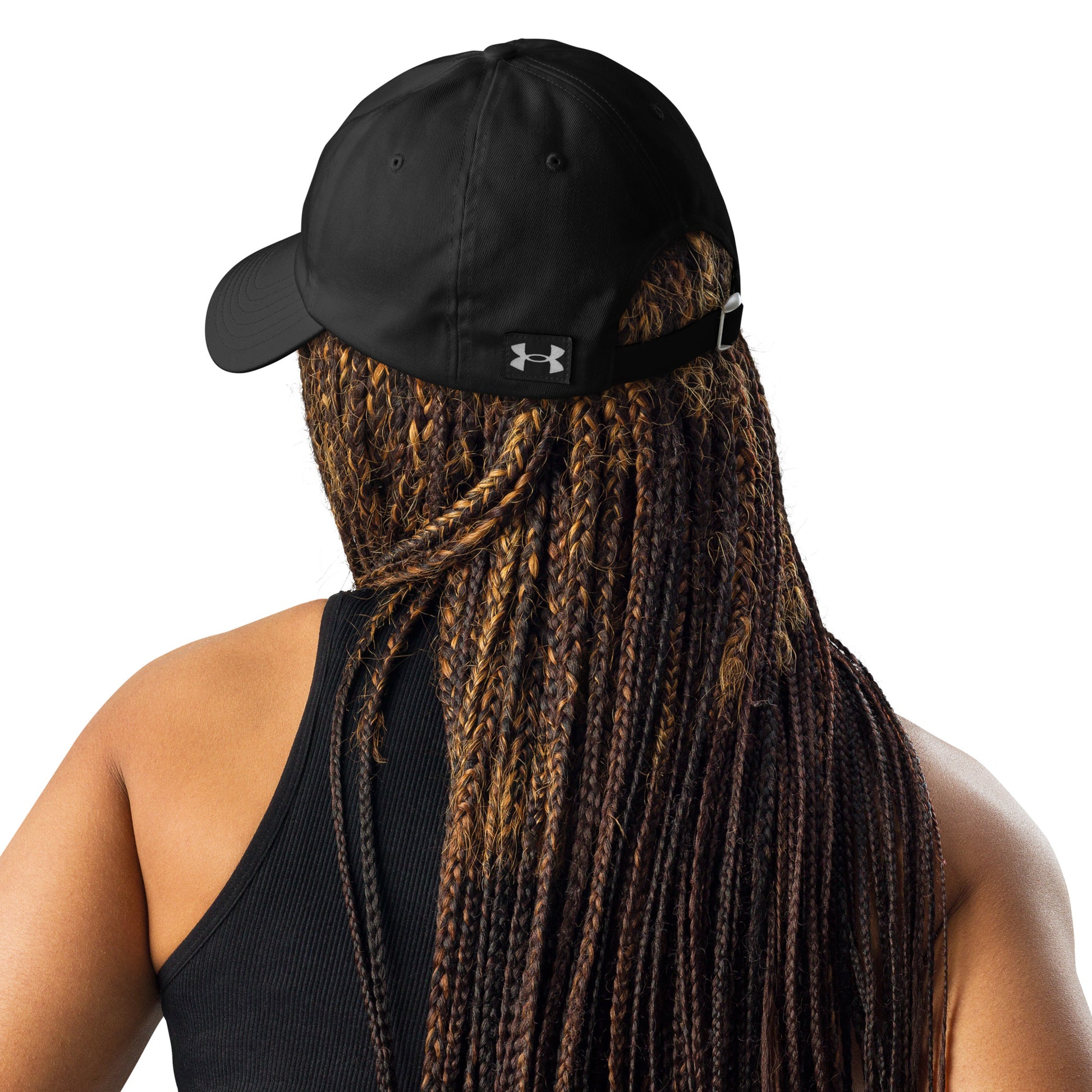 A photo of an athlete wearing black Legendary Under Armour® dad hat featuring an embroidered logo, low-profile unstructured design, adjustable strap, and performance-focused athletic style to elevate your mindset | Product by Wear Grit Brand Clothing