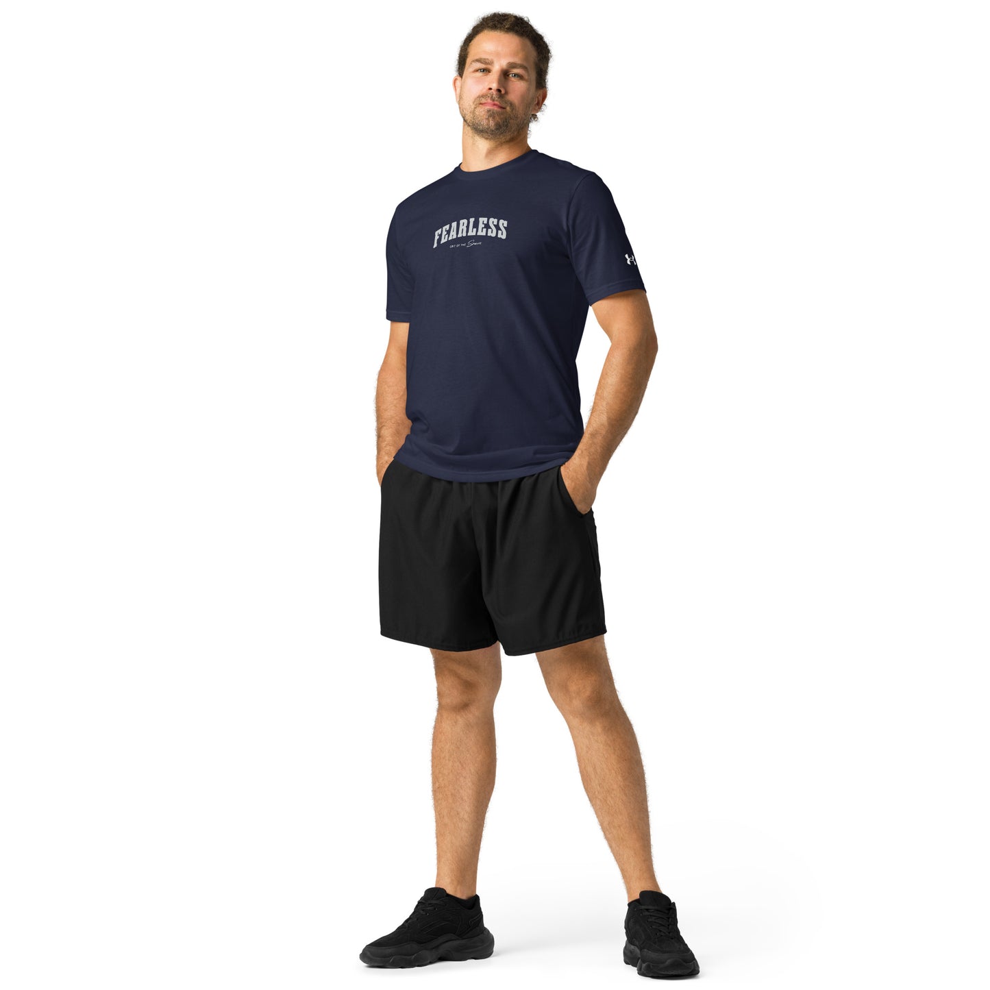 athlete wearing navy Fearless Under ArmourⓇ fitness t-shirt for training and workouts with relaxed fit and split hem