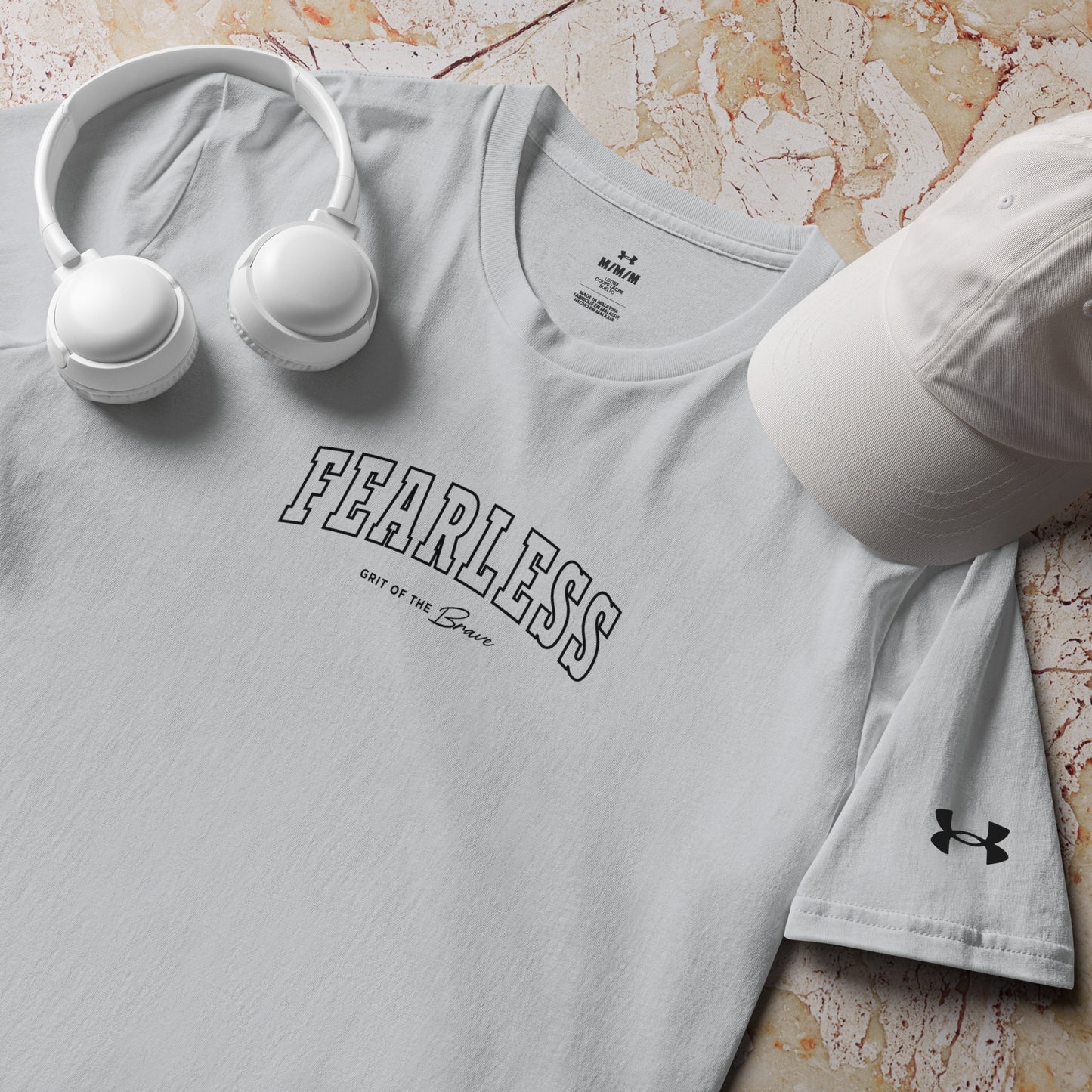 a product shot of grey Fearless Under ArmourⓇ fitness t-shirt for training and workouts with relaxed fit and split hem