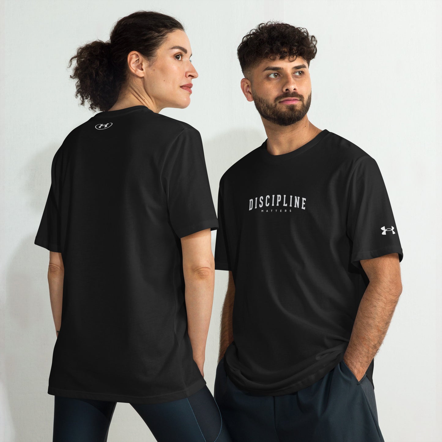 Models with Discipline Under Armour athletic t-shirt for training, fitness, and mindset-focused motivational performance sportswear by Wear Grit Brand Clothing