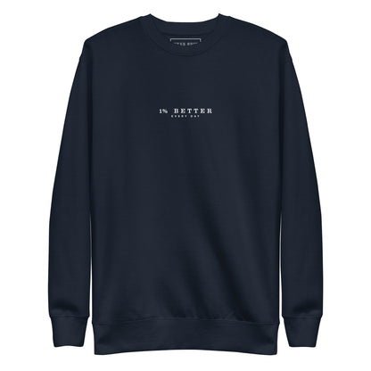 navy sweater with a print 1% Better Every Day — Motivational Grit biege Sweatshirt; mindset apparel for leaders and achievers focused on growth and discipline by wear grit brand clothing