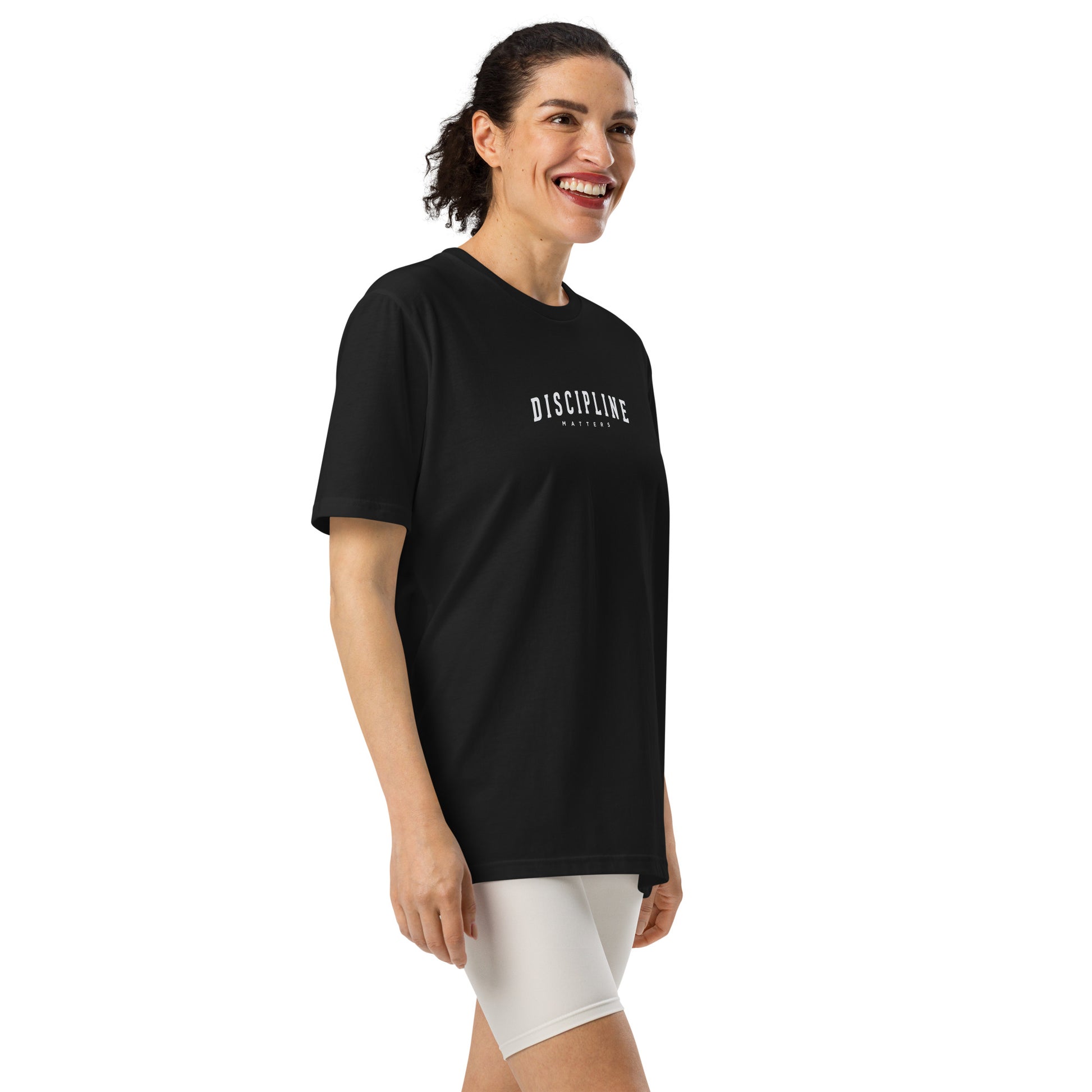 a woman wearing black Discipline Under Armour athletic t-shirt for training, fitness, and mindset-focused motivational performance sportswear by Wear Grit Brand Clothing