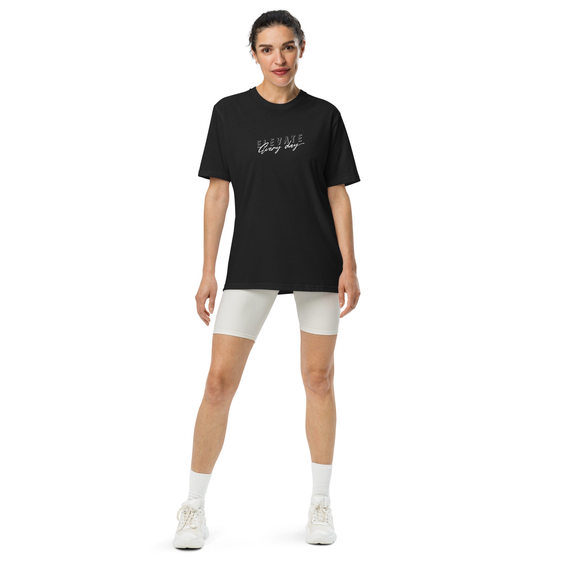 a woman wearing Elevate Every Day Under ArmourⓇ athletic t-shirt with relaxed fit and premium performance fabric, motivational sportswear by Wear Grit Brand Clothing