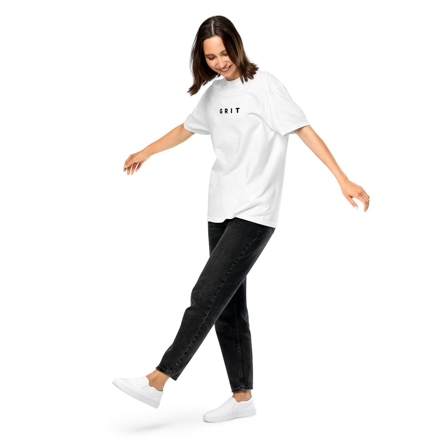 A woman wearing white Grit T-Shirt mindset-driven apparel designed for discipline, focus, consistency, and everyday growth by Wear Grit Brand